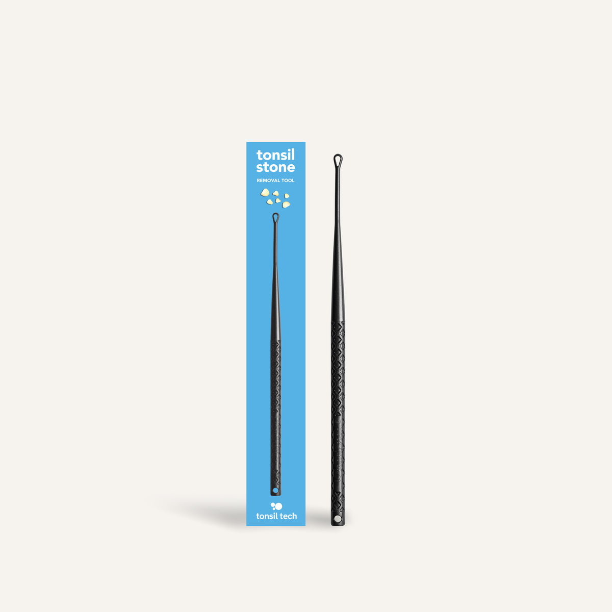 Blue Tonsil Stone Removal Tool Single box with a single Medium sized black Tonsil Stone Removal Tool on the right side of the box